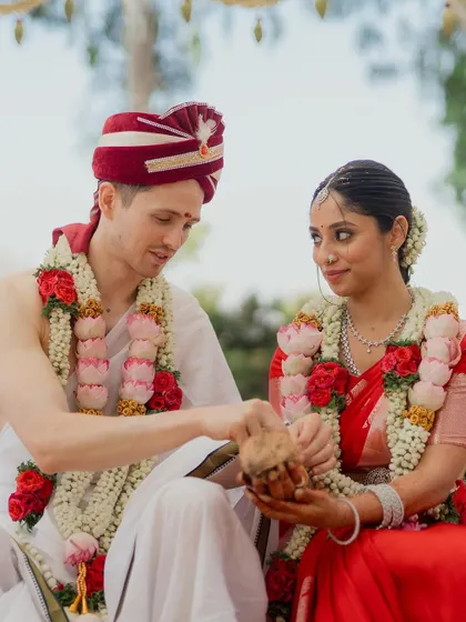 A beautiful moment from a cross-cultural wedding, blending South Indian rituals with Western traditions. I take pride in seamlessly weaving different customs together to reflect the couple's unique story.