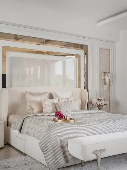 A beautifully appointed bedroom showcasing our signature style of quiet luxury. This space combines layered textures, a soothing color palette, and bespoke furniture to create a personal sanctuary for rest and relaxation.