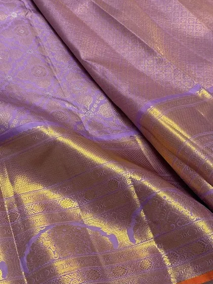 A detail shot showing the beautiful sheen and texture of the pure Kanchipuram silk.