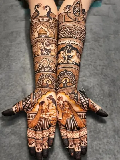 This full bridal design includes portraits of the couple exchanging varmalas, a classic wedding scene captured in henna.