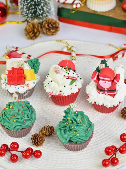A delightful spread of my Christmas-themed cupcake and cake candles. These sweet-looking treats are perfect for festive decor or as a unique Secret Santa gift.