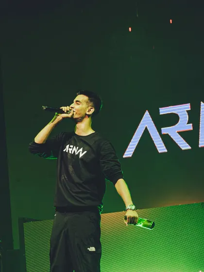 It's not just about the music; it's about performance. Here I am on the mic, hyping up the crowd and ensuring everyone is part of the show, a key element of my stage presence.