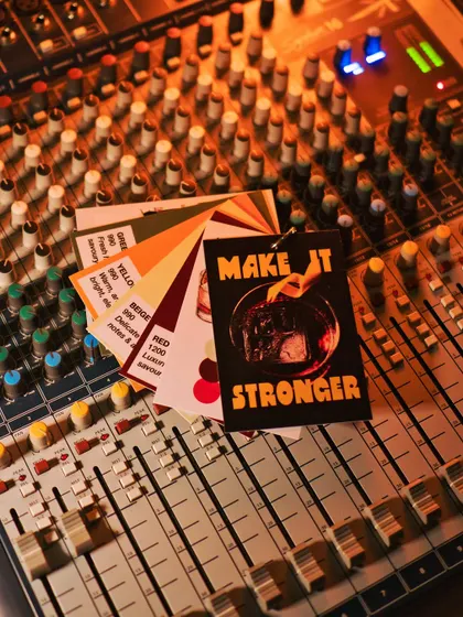 Our Pantone-inspired Negroni menu swatches, laid out on the sound mixer. This event blended the worlds of design, music, and mixology.