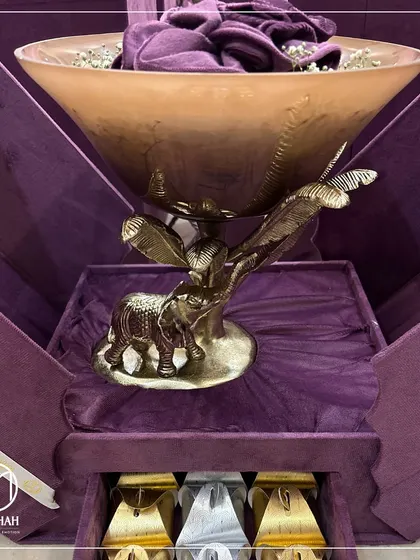 The Elephant Bowl presented in a deep purple, custom-designed box with a drawer for additional treats. This is a complete and luxurious gifting solution.