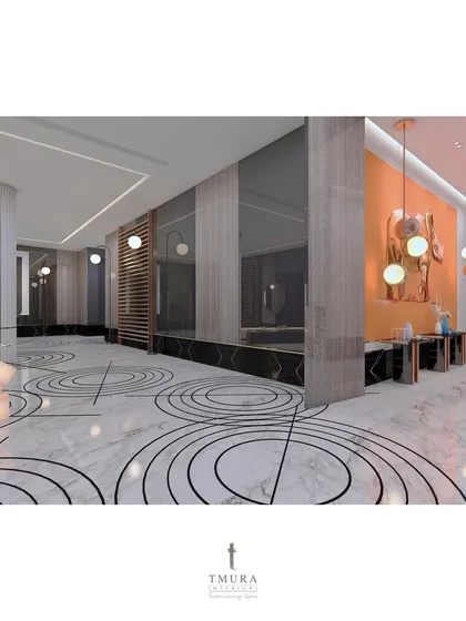 Another view of the foyer, showing how the geometric floor inlay guides the eye through the space towards different zones, each highlighted with unique art and lighting.