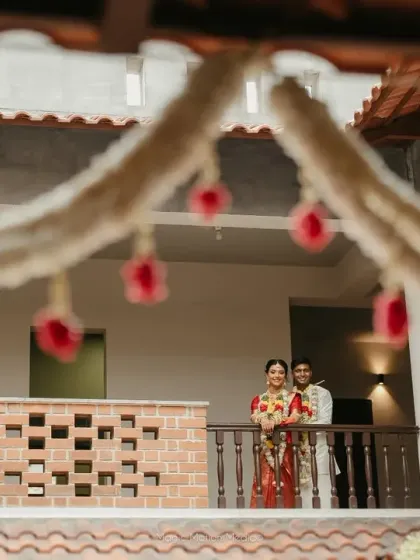 We love the timeless charm of a Chettinad house. For this wedding, we designed the decor to complement the venue's heritage, using traditional floral arrangements and cultural motifs to create an authentic atmosphere.