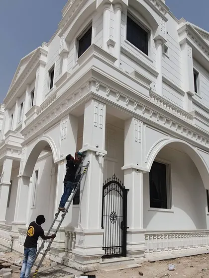 This photo shows the scale of a full villa installation, with my team working on ladders at multiple points to set up complete perimeter security.