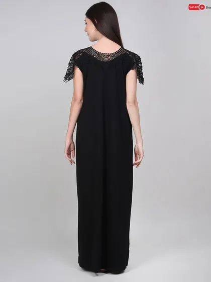 A back view of the nightgown, showcasing the lace detail on the shoulders and the overall cut from behind.
