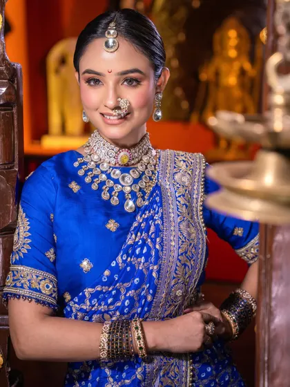 A beautiful smile from my royal blue bride. The look is completed with a traditional bindi and nath, perfectly balanced with soft, glowing makeup.