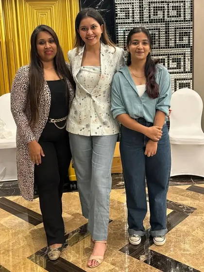 Posing with my incredible team. A strong team is the backbone of a scalable business. I emphasize the importance of building a positive and efficient team culture.
