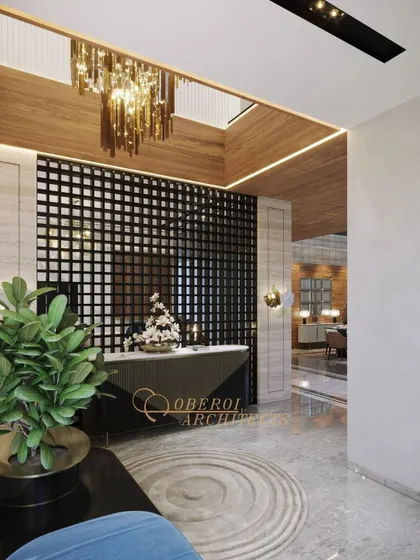 A modern entryway with a dramatic black grid partition, a skylight with a cascading chandelier, and a mix of marble and wood textures.