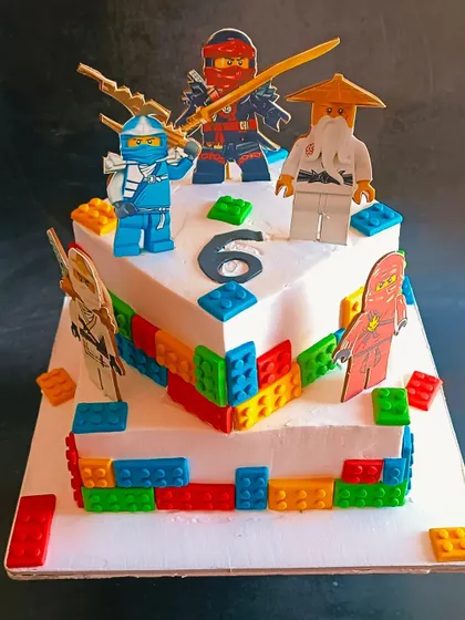 A unique L-shaped Ninja Lego cake, combining two favourite themes into one action-packed birthday celebration.