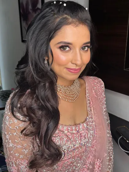 A close-up of the Sangeet makeup, with a focus on shimmery pink eyeshadow and glowing skin.