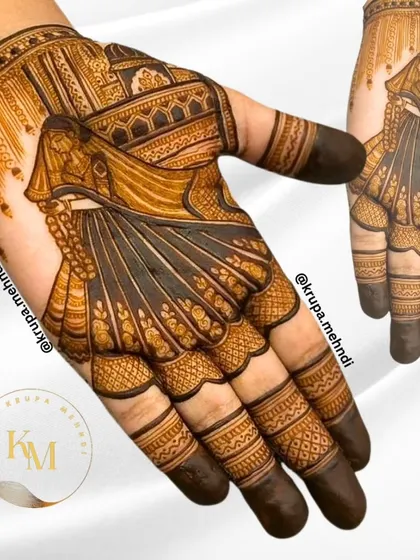 This single-hand bridal design showcases a graceful bride figure with a detailed ghaghra. It's a great inspo for brides who want intricate art that feels both traditional and elegant.
