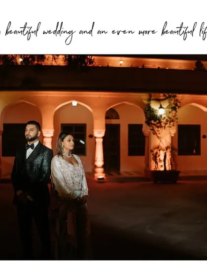 "Cheers to a beautiful wedding and an even more beautiful life together." A final, stylish portrait of the couple at their reception, capturing their elegance and the magic of the night.