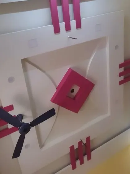 A fun, blocky design in pink and white for a kid's bedroom. This style is playful and modern, and perfectly integrates the ceiling fan.