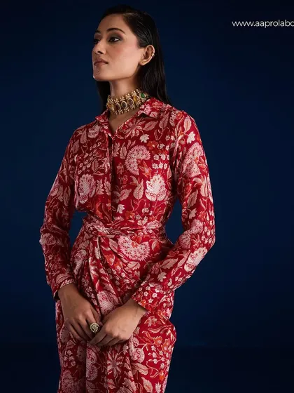 A profile shot of the Rosela Draped Skirt Set from Aapro, showing the intricate print and wrap detail.
