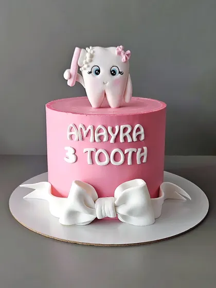 Celebrating Amayra's teenie weenie first tooth. This cookies and cream cake is a fun way to mark a baby's milestone, featuring a cute tooth fairy character.
