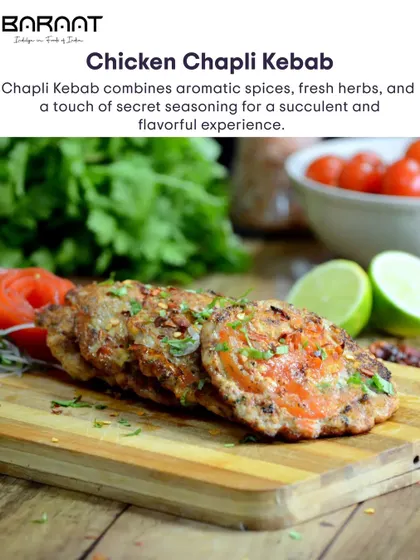 A closer look at the Chicken Chapli Kebab, showcasing the fresh tomato and herbs that make this dish so unique.