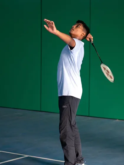 A young man perfects his serving motion in our adult class. We focus on getting the fundamentals right to build a solid foundation.