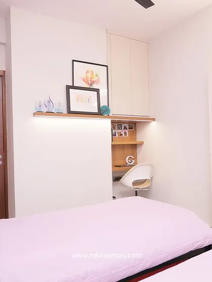 The twin bedroom, showing the clever use of space with the built-in desk and shelf.