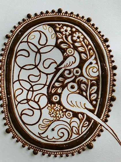 Another angle of the parrot cutwork art, highlighting the intricate details.