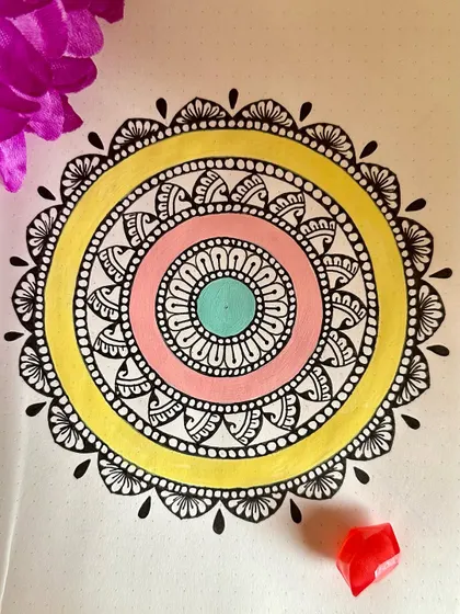 Pastel Paradise. This simple yet cheerful mandala uses soft shades of pink, yellow, and mint green. It’s a great example of how a few colors can create a lovely, calming effect.