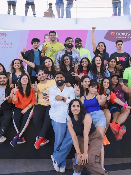 A fun, celebratory group photo on stage after a successful charity event. These moments show the power of community and coming together for a good cause.