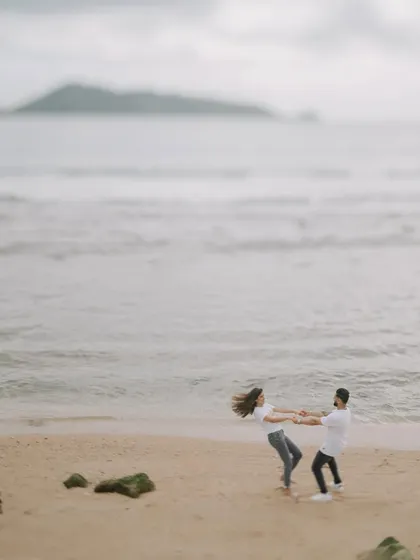 A playful, candid moment as Harman and Komal spin around on a quiet beach in Phuket. These are the fun, natural interactions I love to capture.