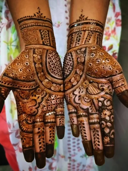 A rich and detailed party mehendi design covering both palms. This style is perfect for someone who wants a fuller look without committing to a full bridal design.