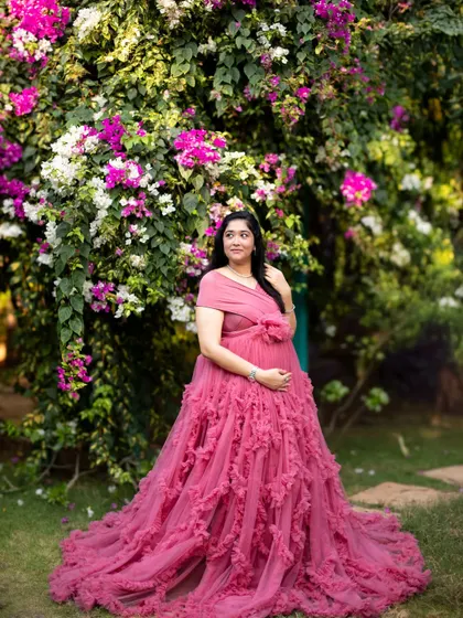 A solo portrait of the mom-to-be surrounded by flowers, her expression full of peaceful anticipation for the new arrival.