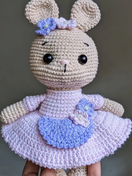 A close-up of the bunny in her dress, showing the floral details.