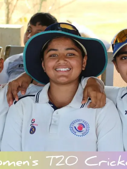 A happy moment captured in the dugout, showing the camaraderie among the players.