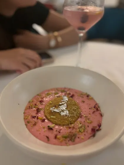 A creamy rose phirni from one of our special tasting menus. This traditional rice pudding is infused with rose water and topped with pistachios and a delicate biscuit.