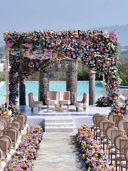 A breathtaking mandap overlooking the hills of Udaipur. I designed this pastel floral paradise by the poolside to feel both grand and intimate, creating a serene and royal setting for the wedding vows.