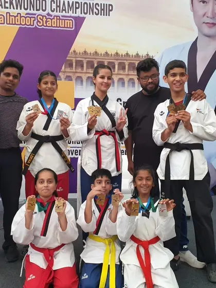 A mix of our junior and senior athletes showing off their medals. This picture captures the range of talent we nurture at KTA.
