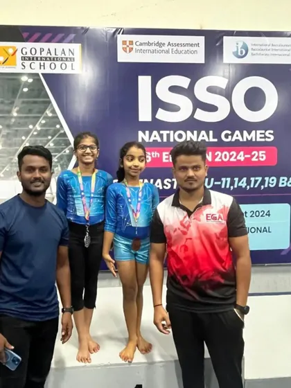 Our coaches with national medalists Shloka and Ria. We are committed to providing the guidance and support needed to compete at the highest levels.