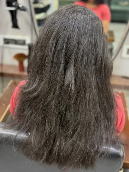 The "before" shot of a major transformation. This shows the frizzy, dry hair that we turned into a velvety, glossy brown masterpiece.