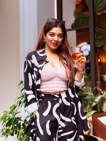 A stylish guest enjoys a drink during our Sunday celebration. It was an afternoon where memories filled the air and stories lost to time came to life on the plate and in the glass.