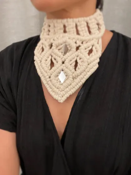 This macrame choker looks so elegant against a dark top. It's a versatile piece that works for festival fashion, beachwear, or even with a traditional saree.