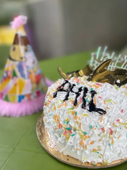 A party isn't complete without a cake and a hat. We pay attention to the little details that make a pet's birthday feel extra special. Just look at this delicious, pet-friendly cake ready for the birthday boy.