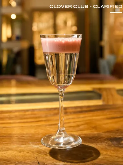 The Clover Club - Clarified, a visually stunning, crystal-clear version of the classic gin cocktail.