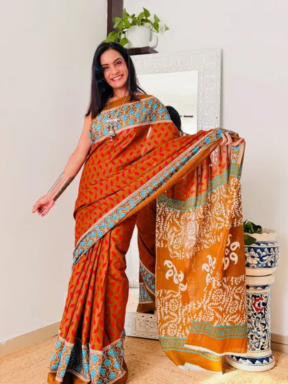 The combination of rust orange and blue in this cotton mulmul saree is so unique and beautiful. It's a great example of the amazing prints you can find on a budget.