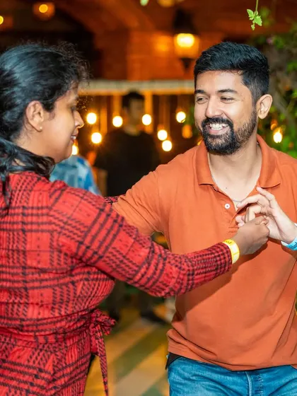 A happy connection between partners, lost in the rhythm of the music. This is what social dancing is all about.