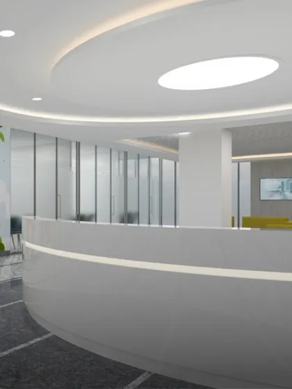 This rendering shows a sleek, modern reception desk for a pediatric clinic. The curved forms and clean white surfaces are designed to be approachable and are complemented by playful wall art in the background.