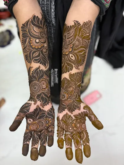 A beautiful example of mixing two different styles on each hand, one with more shading and one with more bold, filled-in work.