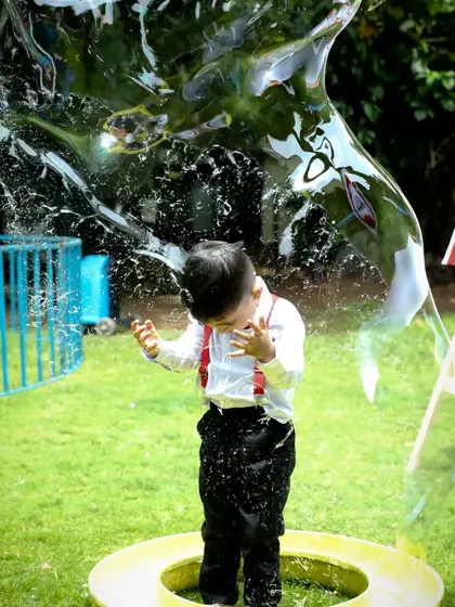 A giant bubble activity at a classic carnival party. I always include interactive and sensory activities like this to keep guests of all ages entertained and create joyful, candid moments.