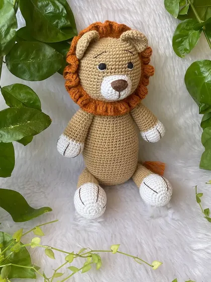 This large lion in a soft beige color is so huggable. His gentle expression and soft mane make him a comforting friend for children.