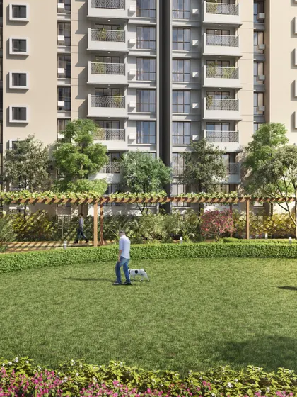 Another view of the community lawn, showing residents walking their pets and enjoying the landscaped environment, adding to the sense of a lively neighborhood.