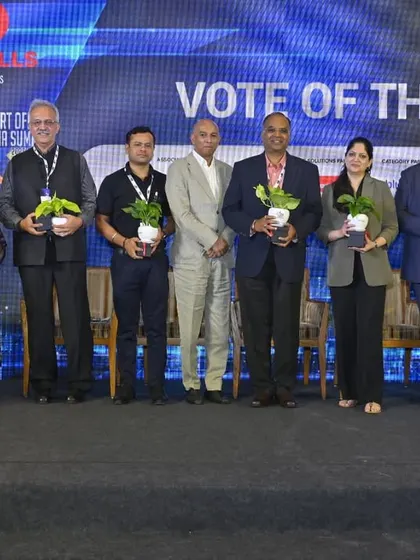 The panel members at the Smart Office India Summit receiving plants as a token of thanks, a fitting gesture for a discussion centered on sustainability and green design.